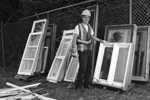 Construction site with organized waste clearance in West Byfleet